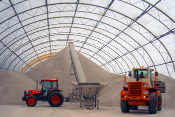 Fabric building storing sand